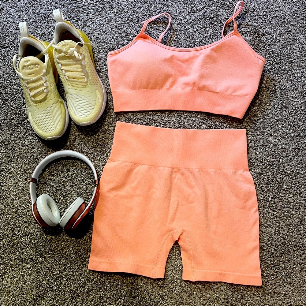 Brand, new sports bra and biker shorts at coral color. Cute